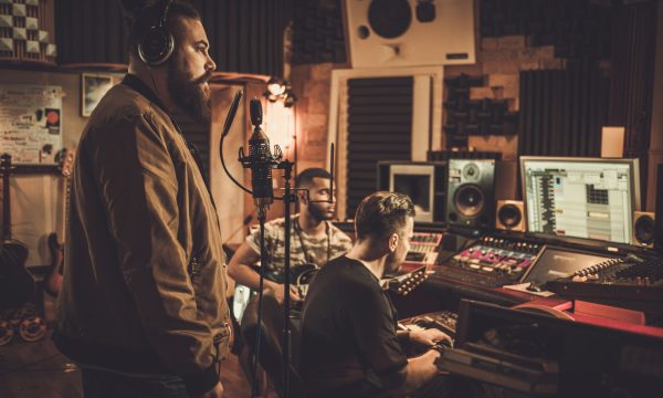 Professional music band recording song in boutique recording stu Professional music band recording song in boutique recording studio.